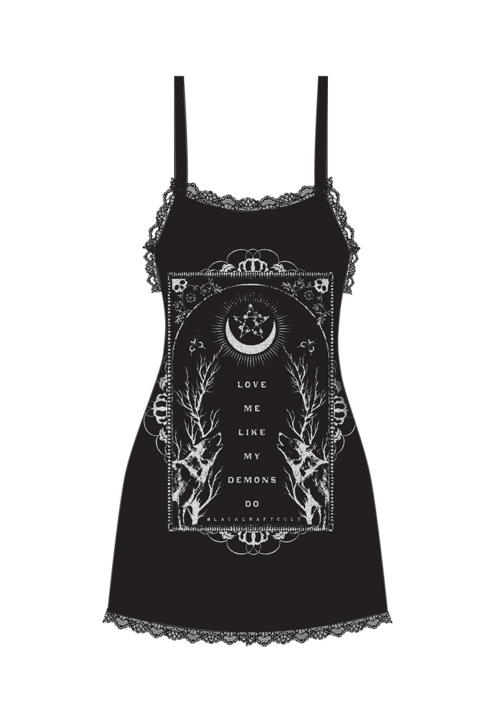 A black soft and stretchy mini slip dress with lace trim detail and adjustable spaghetti straps. With custom Blackcraft artwork on the front.