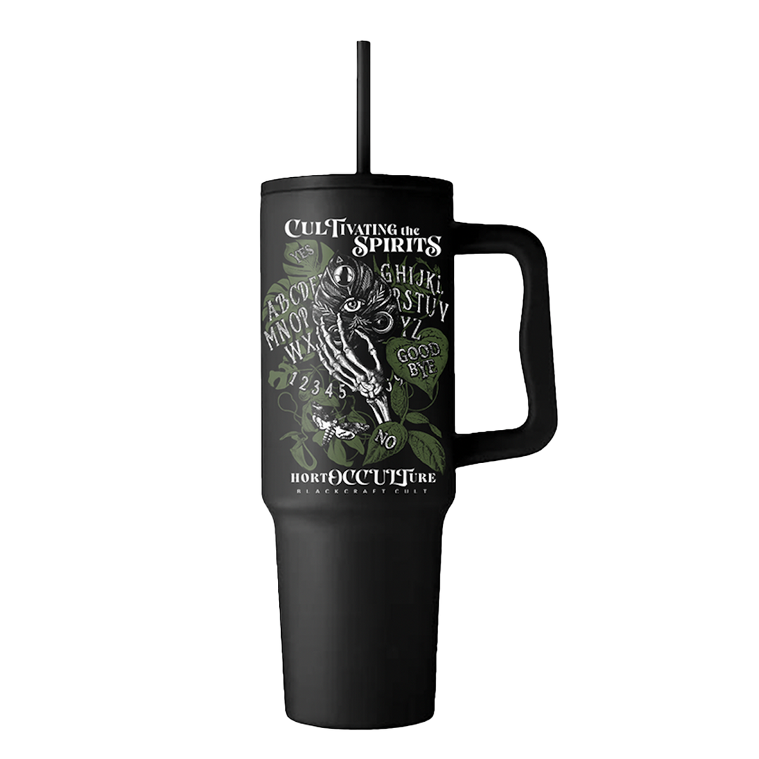 A large black travel tumbler with custom plant witch artwork on the front. From Blackcraft.