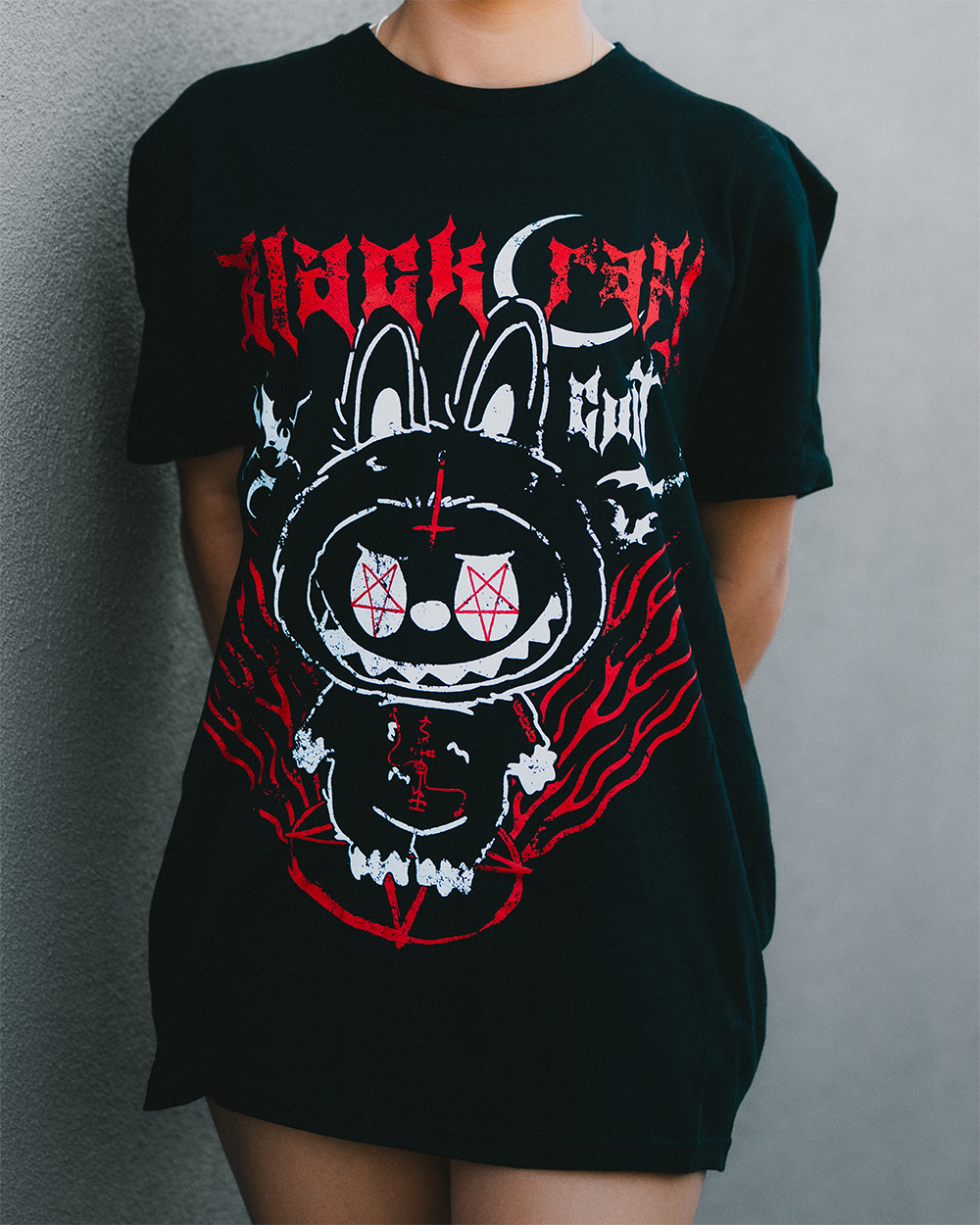 A model wearing a classic black cotton tee with custom Blackcraft artwork on the front. 
