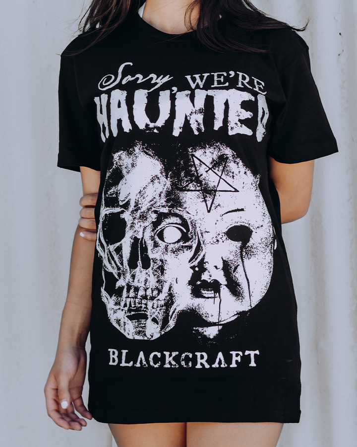 A model wearing a classic black cotton tee with custom Blackcraft artwork across the front. 