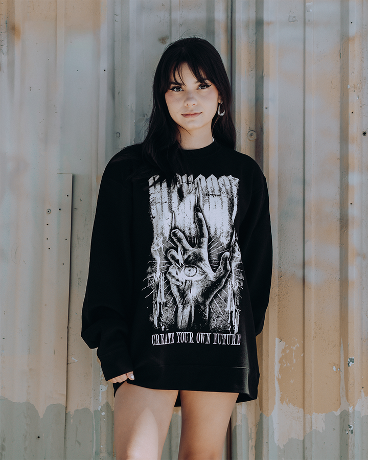 A model wearing a classic black sweatshirt with custom Blackcraft artwork on the front. 