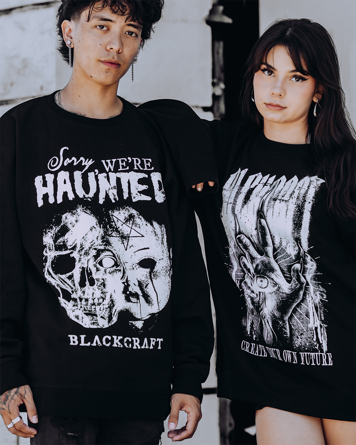 Models wearing classic black sweatshirts with custom Blackcraft artwork on the front. 