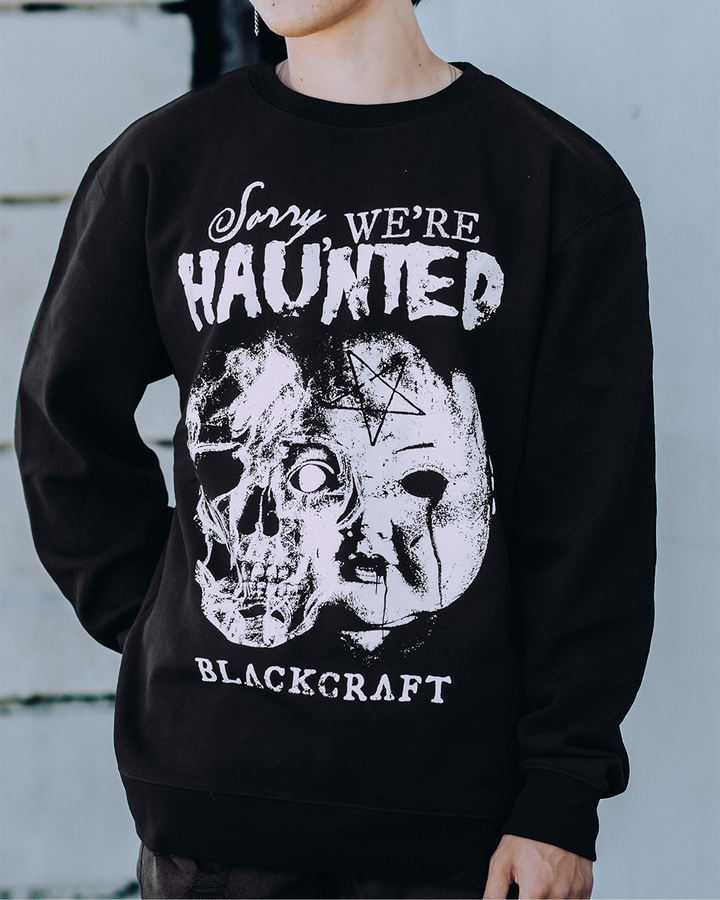A model wearing a classic black sweatshirt with custom Blackcraft artwork on the front. 