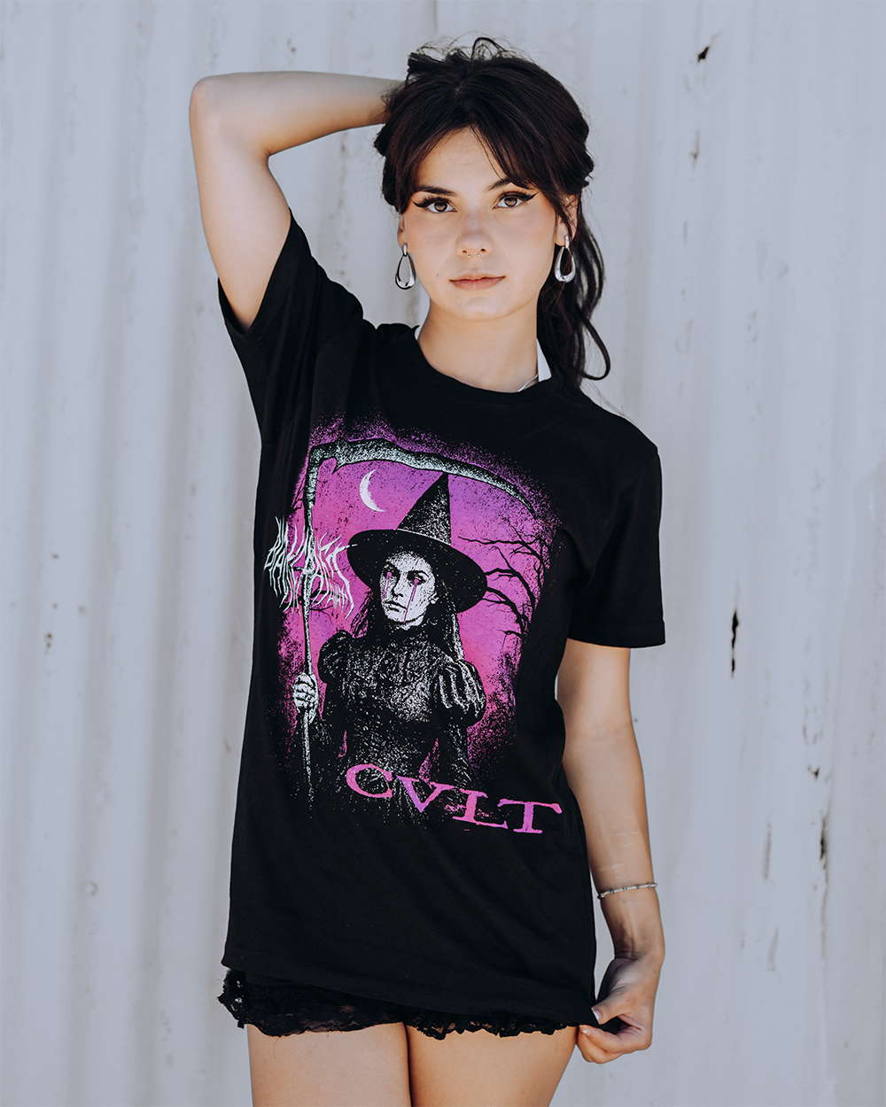 A model wearing a classic black cotton tee with custom Blackcraft artwork across the front and back. 
