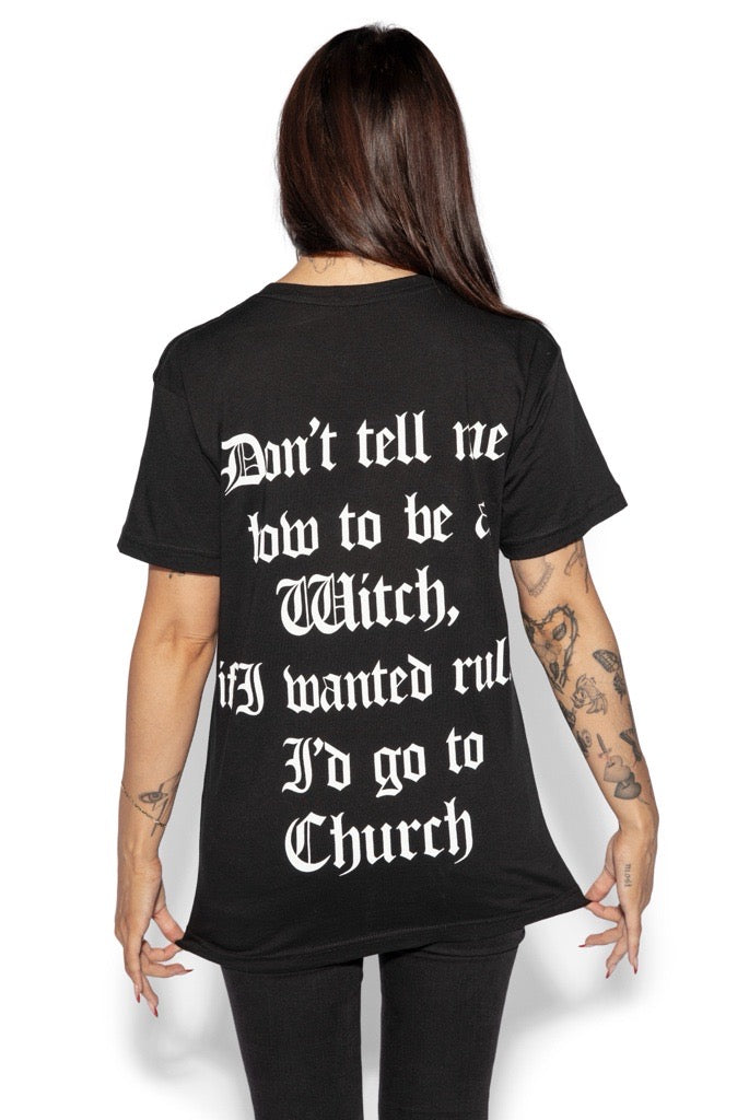 A model wearing a classic black cotton tee shirt with custom Blackcraft artwork on the front and back. 