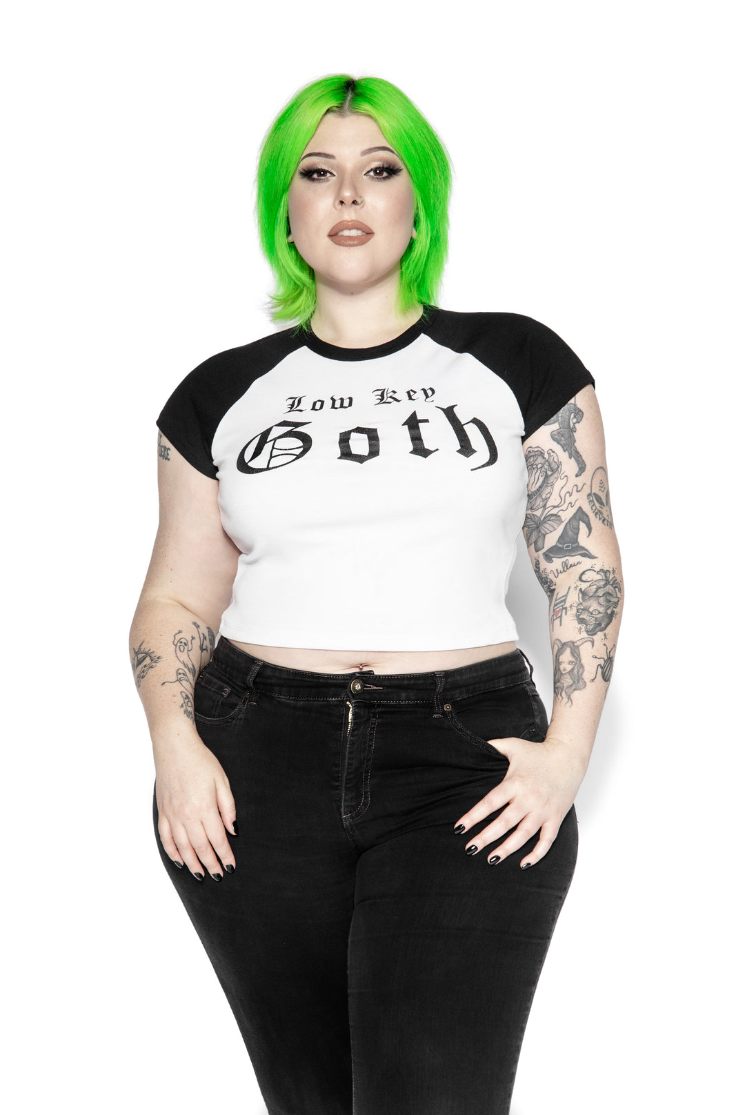 A stretchy raglan tee in white and black with Low Key Goth artwork on the front. 
