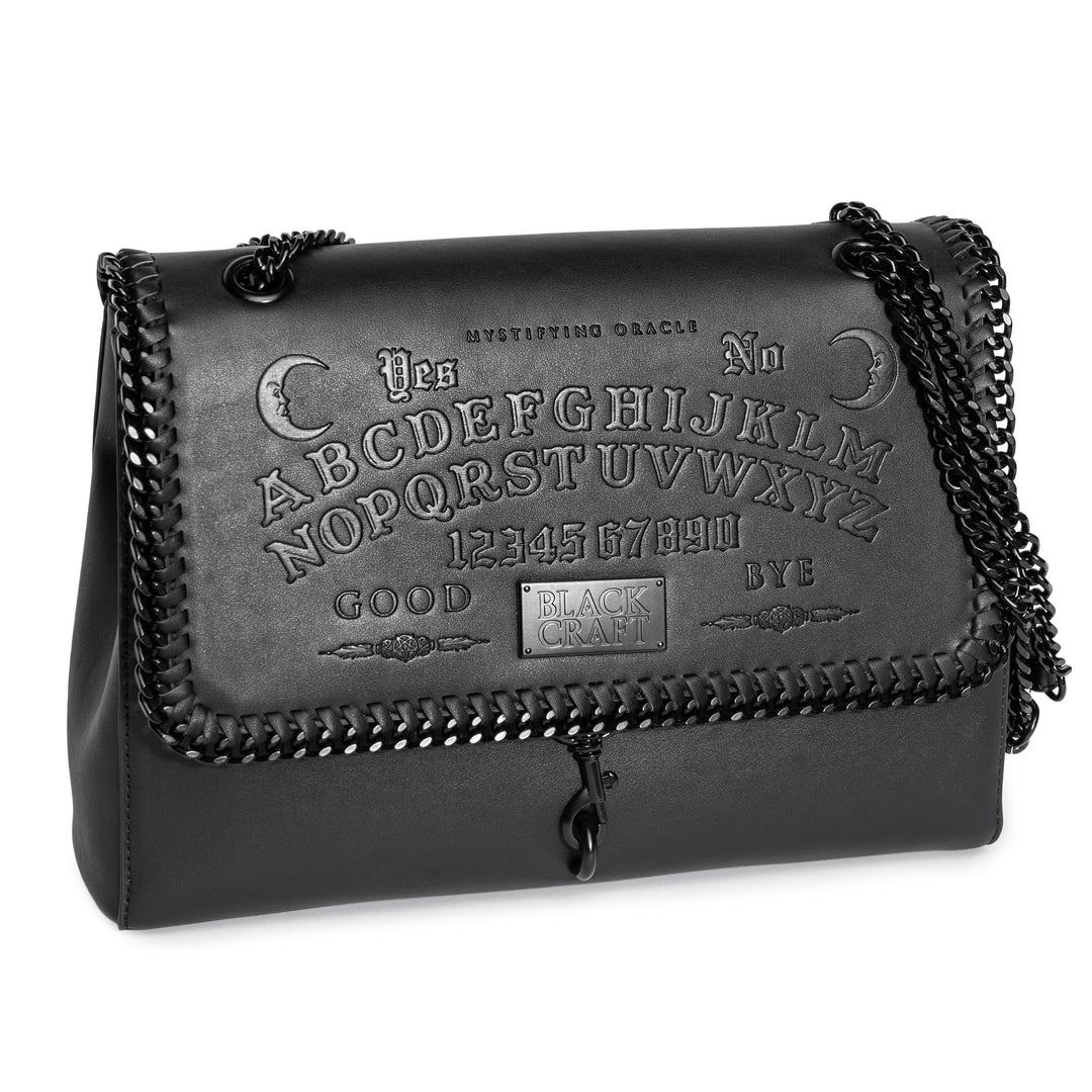 Black PU leather flap shoulder bag with adjustable drop strap and embossed Ouija design.