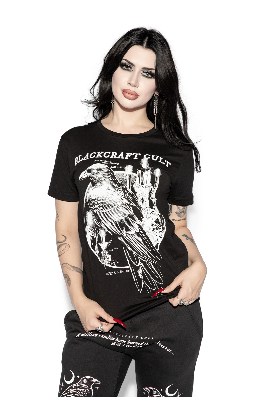 A model wearing a classic black cotton tee shirt with custom Blackcraft artwork on the front. 