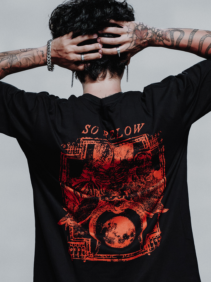 A model wearing a black cotton tee with custom Blackcraft artwork on the front and back. 