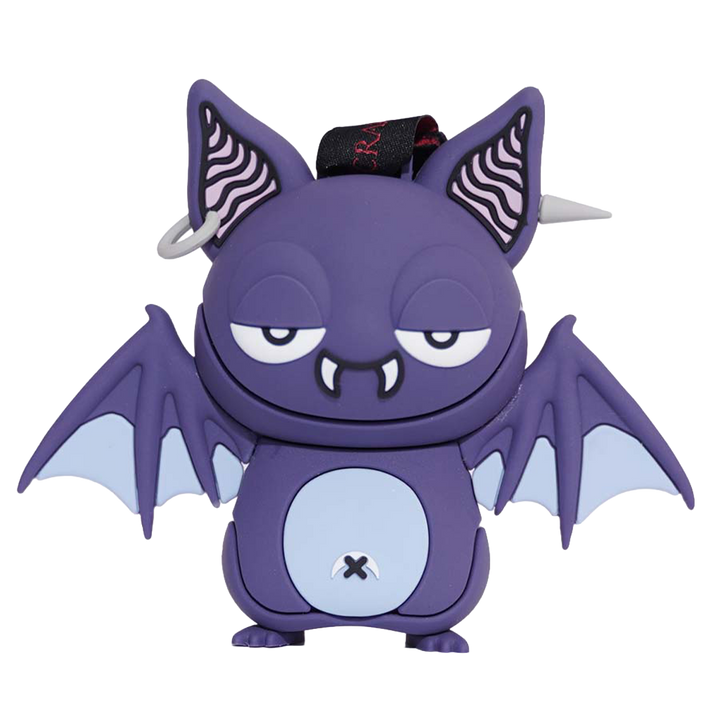 A purple cartoon bat character figurine with large pointed ears with black-and-white wavy patterns, bat wings in pale blue-gray, and a light blue circular belly area with a small black 'X' symbol.