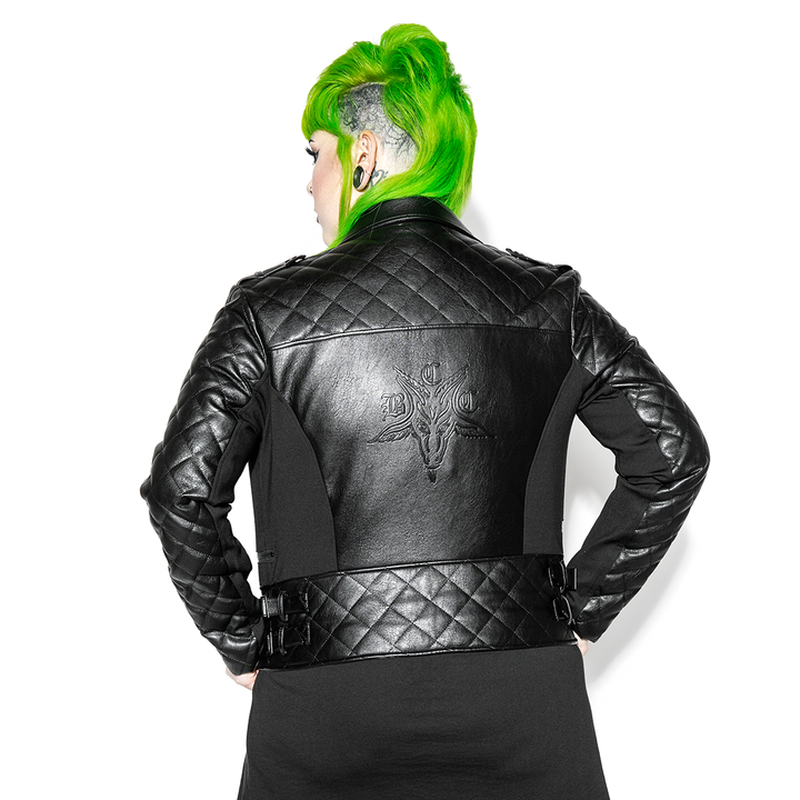 A green haired model wearing a classic black faux leather jacket from Blackcraft.