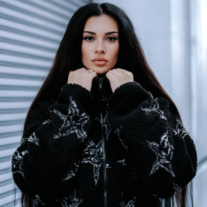 A model wearing a relaxed fit zip up fleece made from ultra soft and cozy fleece. Featuring an allover Baphomet print.