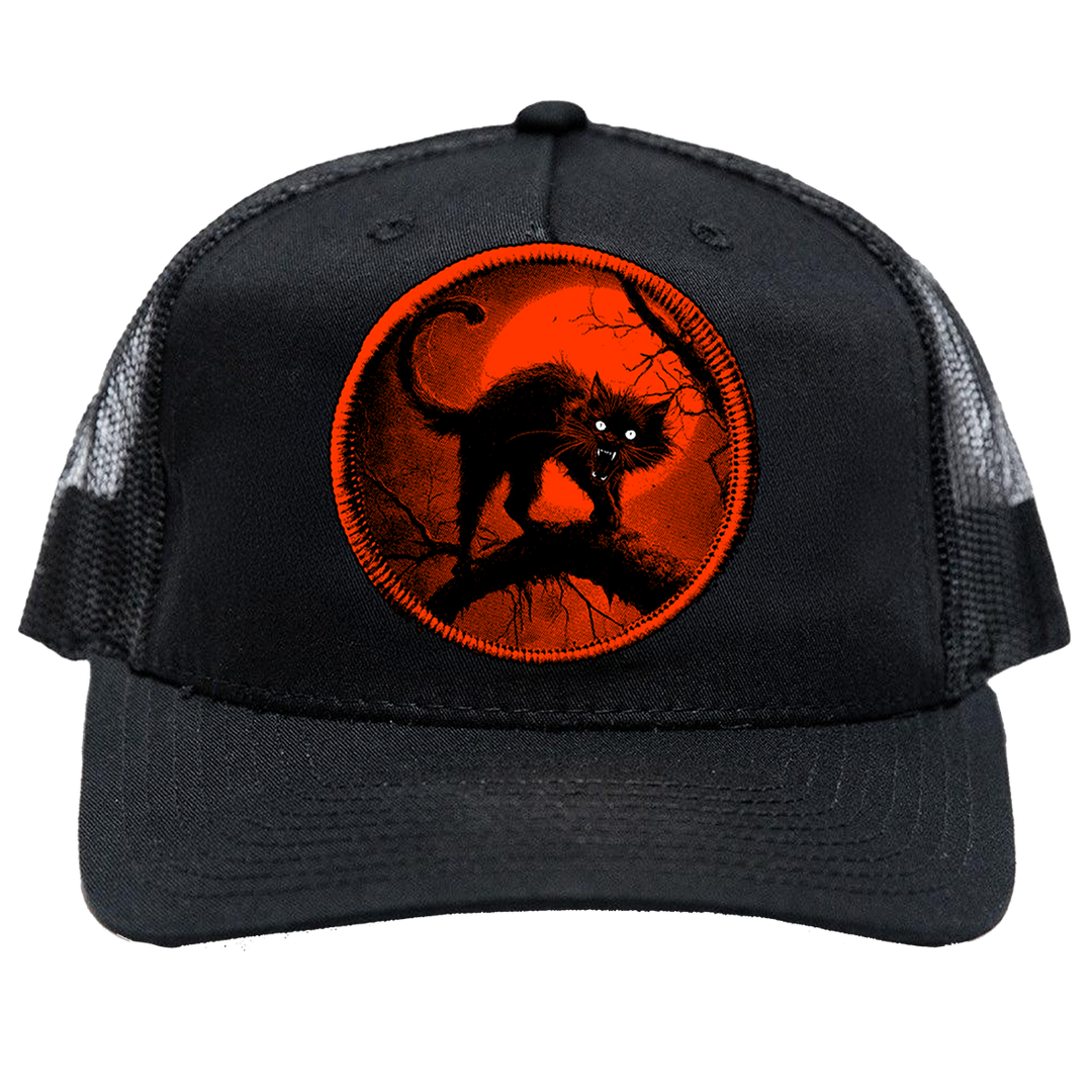 A classic foam trucker hat with a custom Halloween cat patch on the front. 