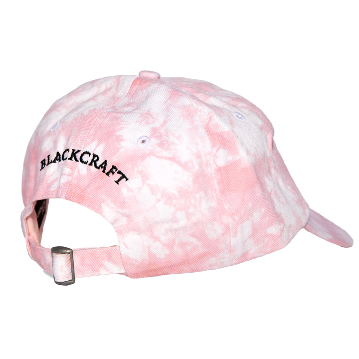 A classic pink tie dye cotton twill hat with embroidered design on the front.