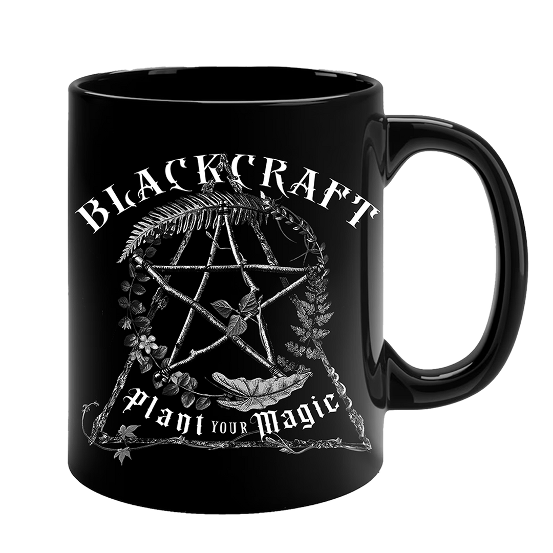 A large glossy black fifteen ounce mug with custom plant witch artwork on the front. From Blackcraft.