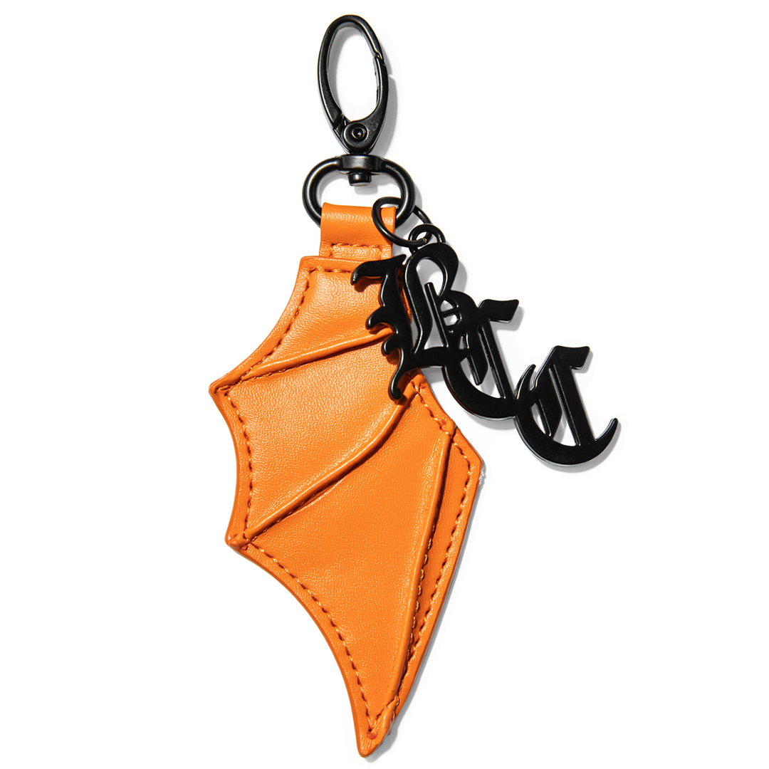 Orange faux leather bat wing keychain.