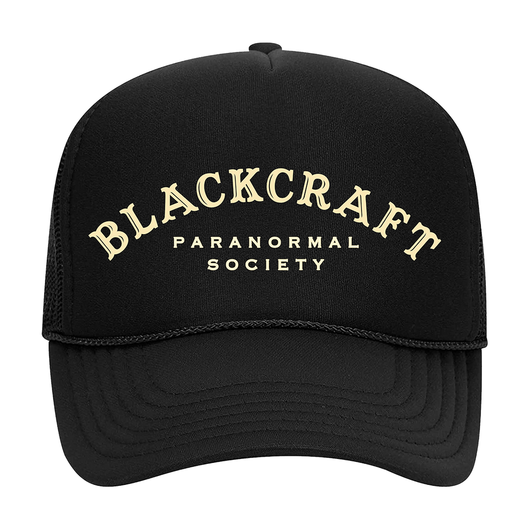 A classic black foam trucker hat with Paranormal Society artwork on the front, from Blackcraft.