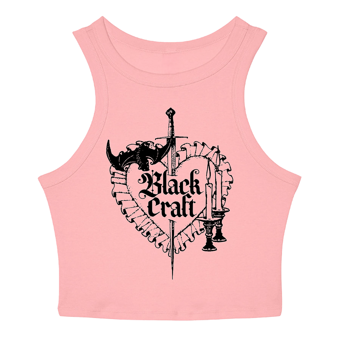 A stretchy pink micro ribbed crop tank top with custom heart and dagger artwork on the front from Blackcraft