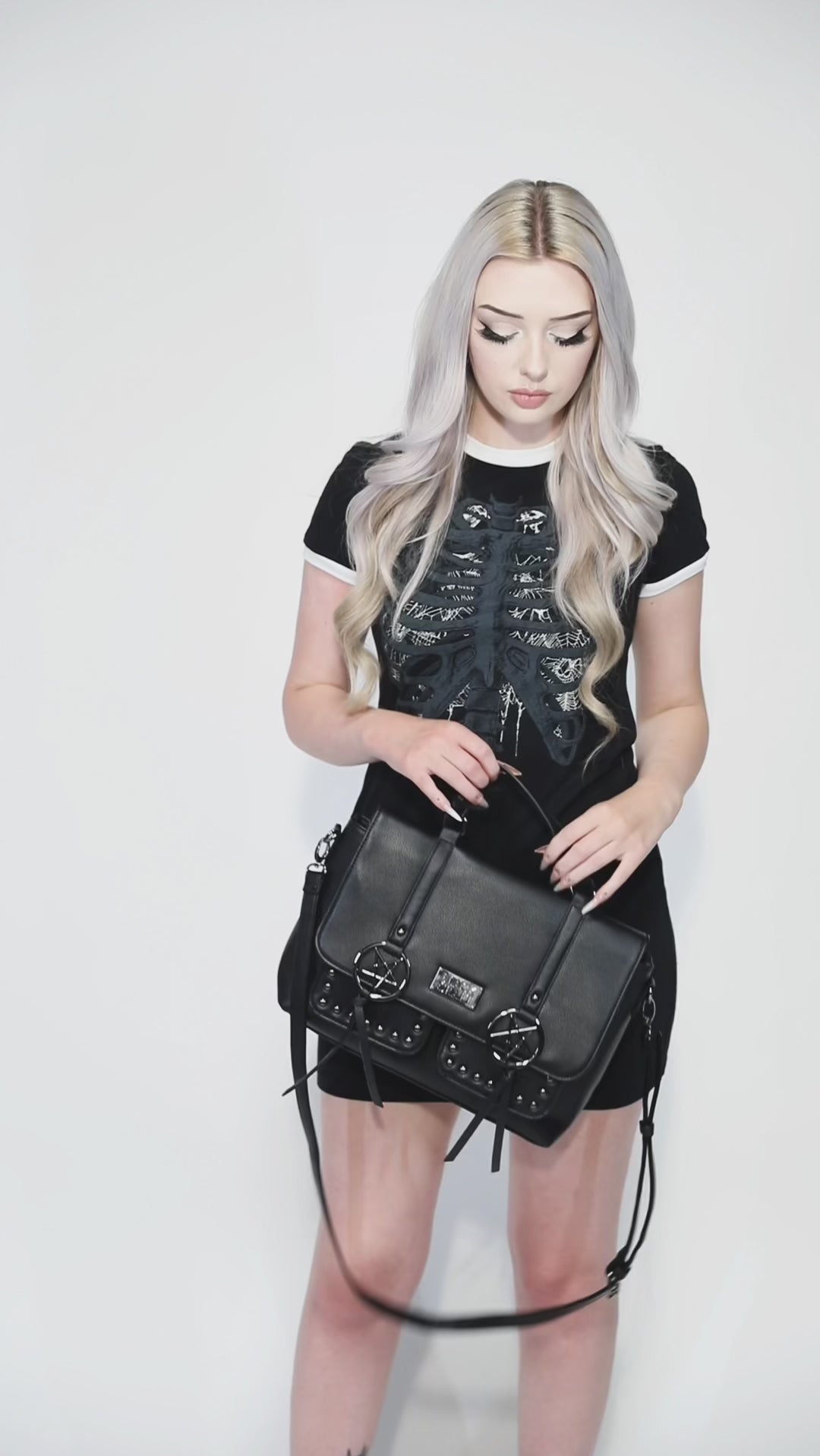 Black faux leather messenger bag with gunmetal finish pentagrams and Blackcraft logo plaque. 