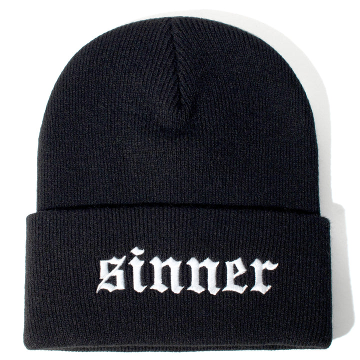 Black beanie with sinner embroidery on front flap.