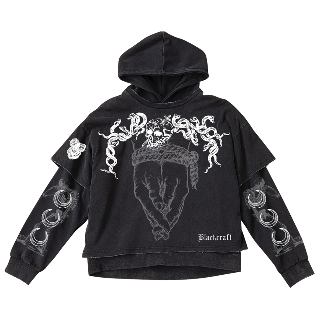 A washed black long sleeve twofer pullover hoodie with custom Blackcraft artwork on the front and along the sleeves.