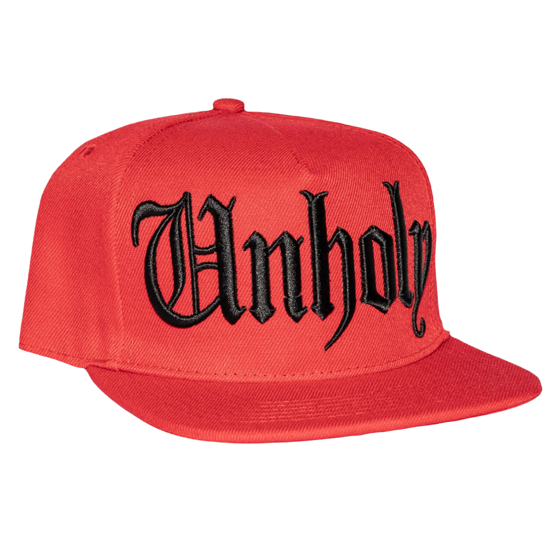 A classic red baseball cap with embroidered unholy across the front.