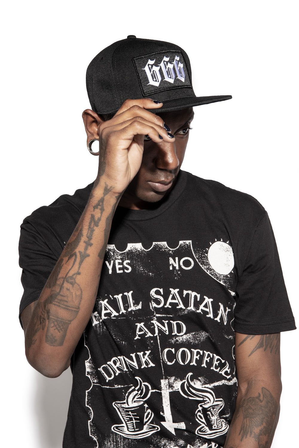A classic black snapback hat with an embroidered six six six patch on the front, from Blackcraft.