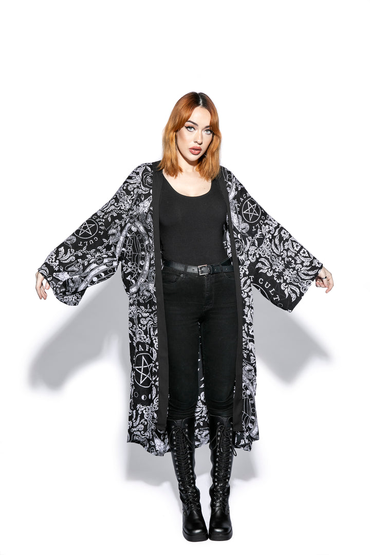 A gothic duster kimono cover up with an open front and long sleeves.