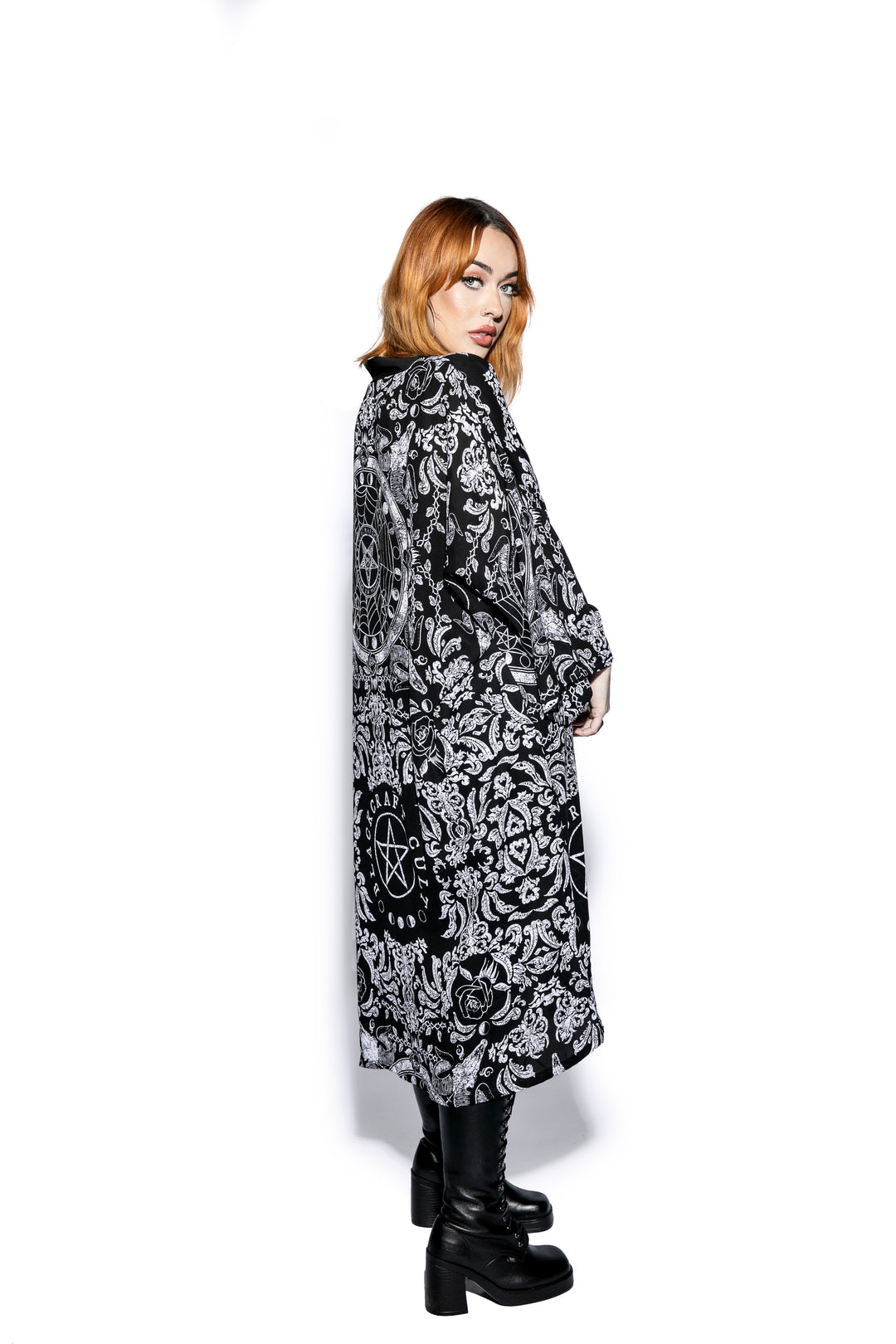 A gothic duster kimono cover up with an open front and long sleeves.