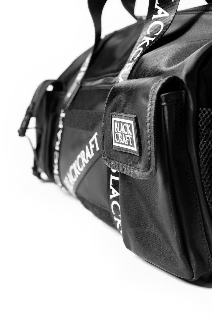 Black nylon duffel bag with Blackcraft rubber logo. 