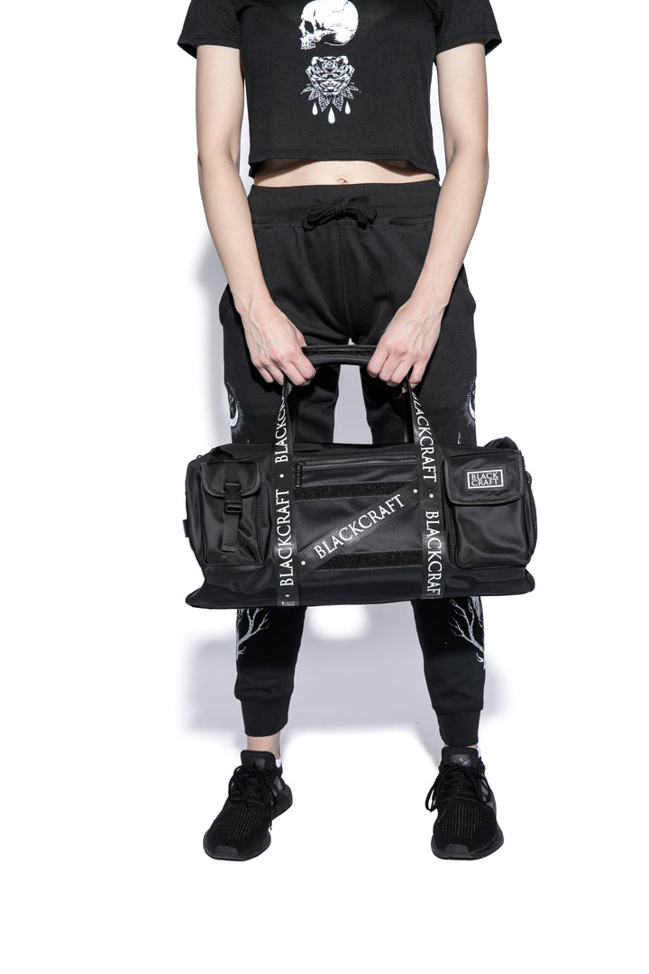 Black nylon duffel bag with Blackcraft rubber logo. 