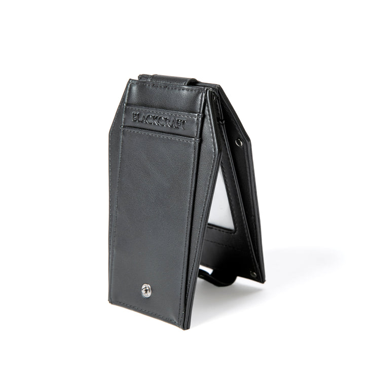 Black faux leather cardholder in coffin shape.