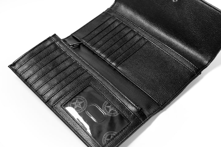 Black faux leather wallet that doubles as a clutch.
