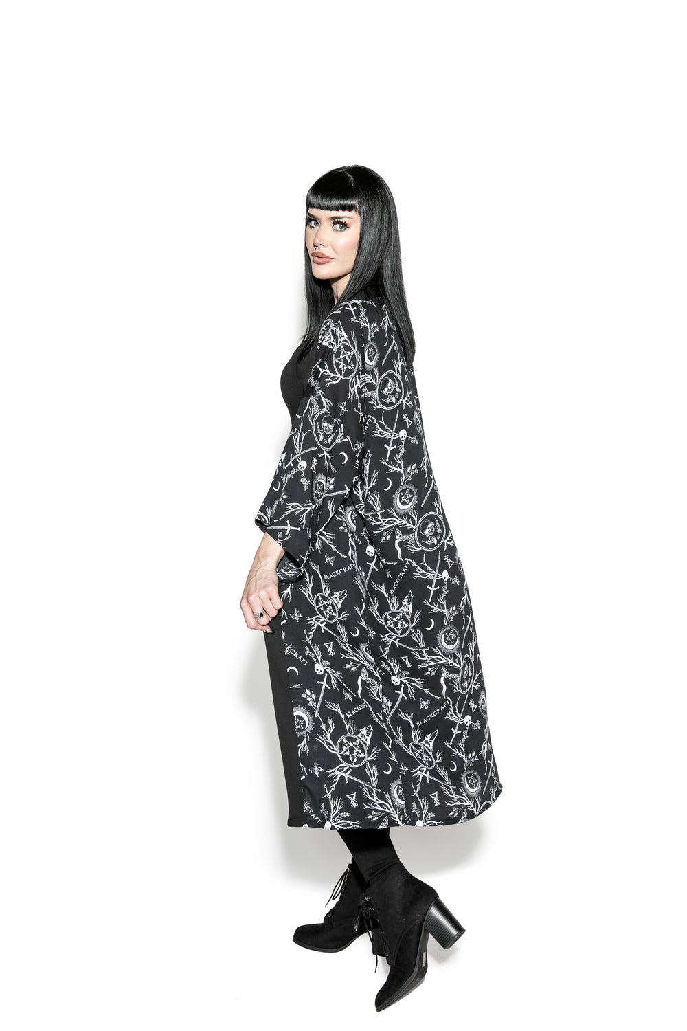A gothic duster kimono cover up with an open front and long sleeves.