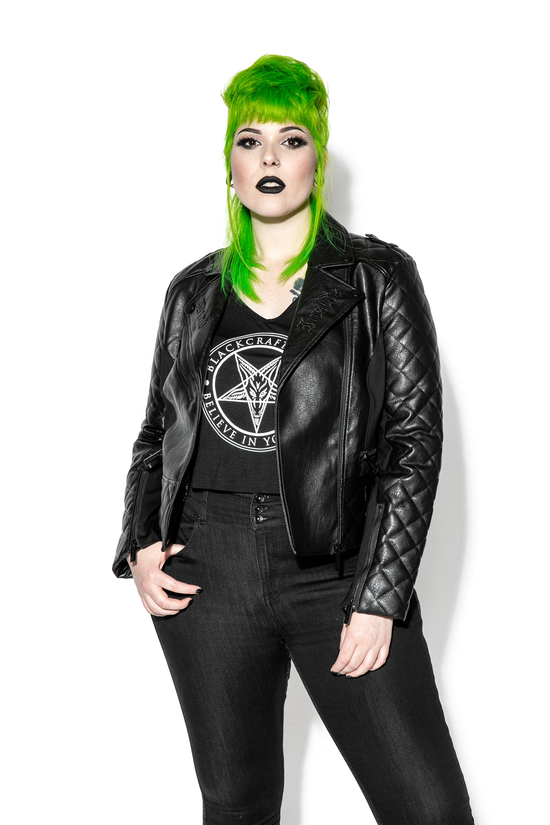 A model wearing a black faux leather jacket from Blackcraft.
