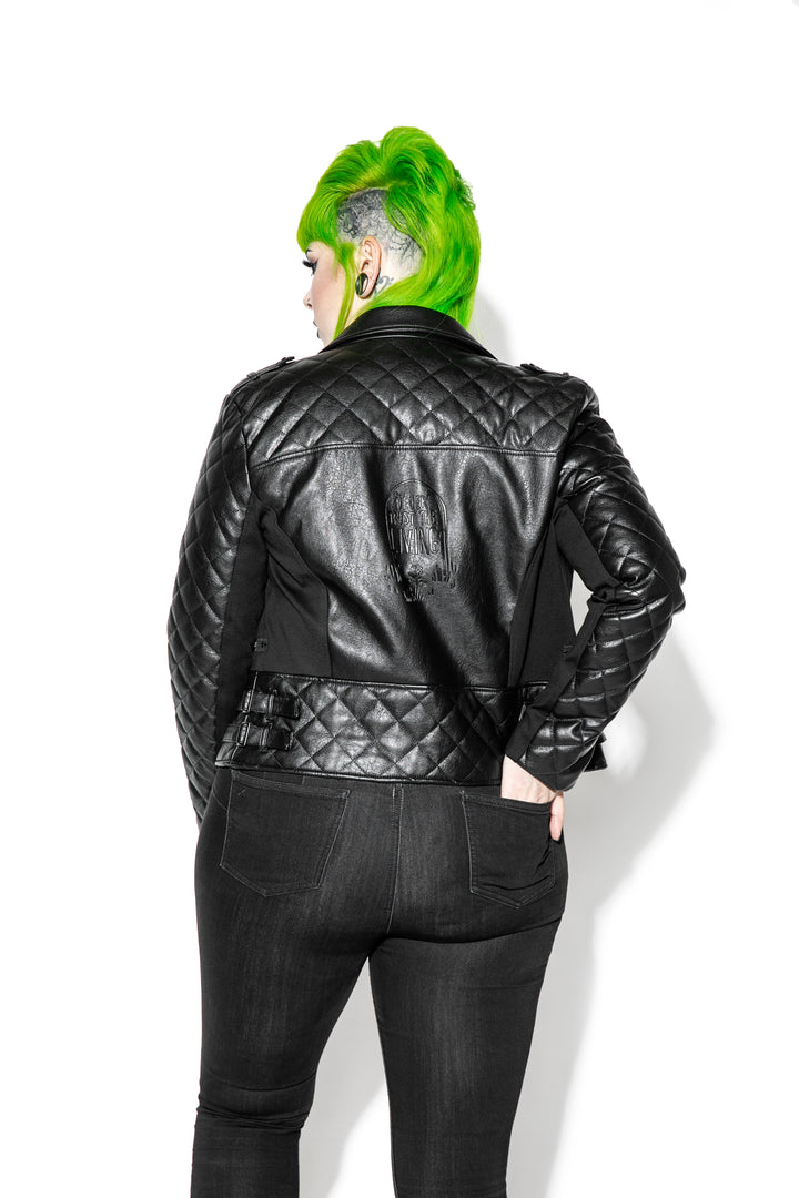 A model wearing a black faux leather jacket from Blackcraft.