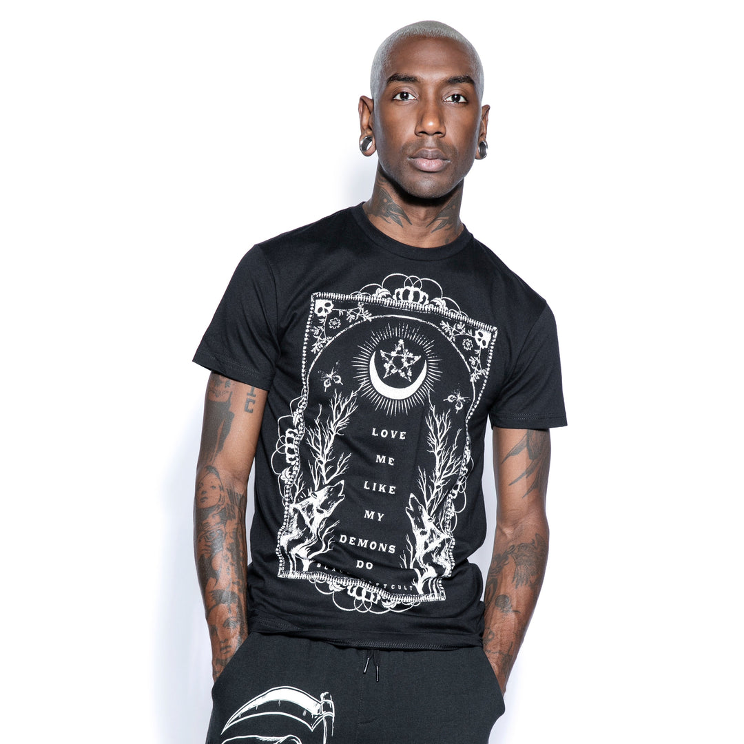 A model wearing a classic black cotton tee with custom Blackcraft artwork on the front. 