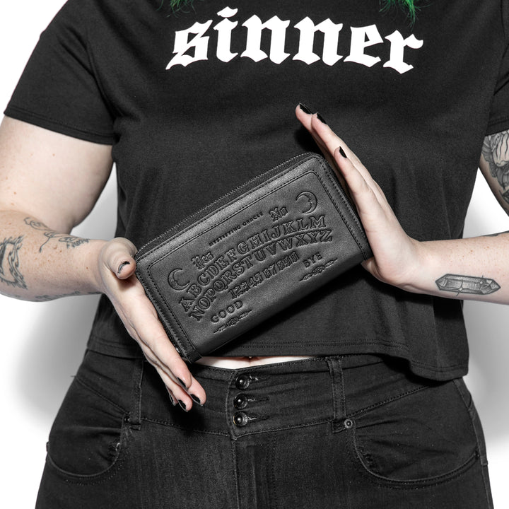 Black faux leather zip around wallet.