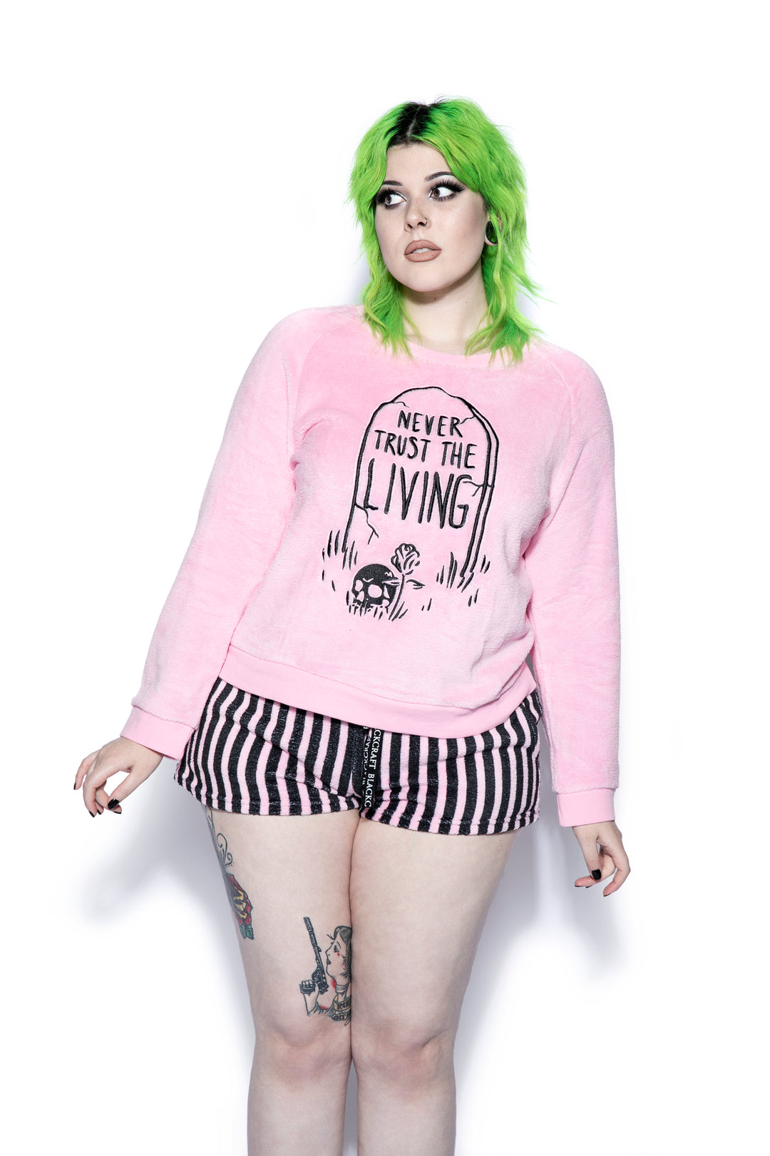 A pink and black soft fleece gothic pajama set featuring a long sleeve pullover top and micro shorts, from Blackcraft.