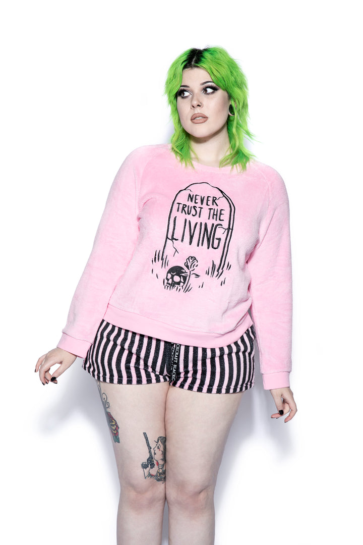 A pink and black soft fleece gothic pajama set featuring a long sleeve pullover top and micro shorts, from Blackcraft.