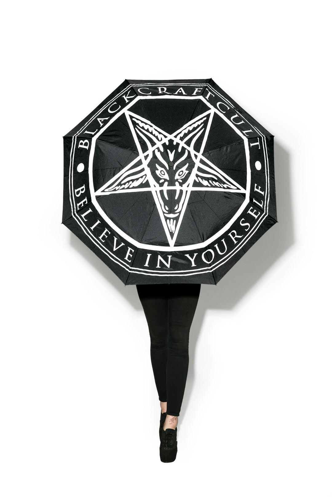A black tri fold umbrella with silk screened Blackcraft artwork.