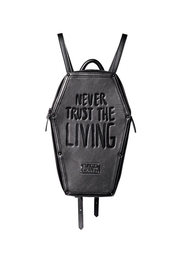 Black faux leather coffin shaped backpack with Never Trust the Living embossed on front. 