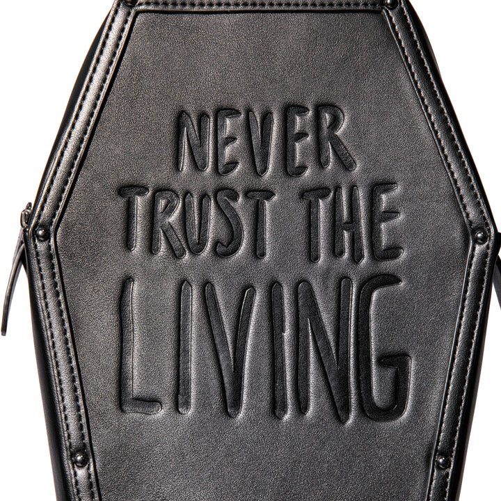 Black faux leather coffin shaped backpack with Never Trust the Living embossed on front. 