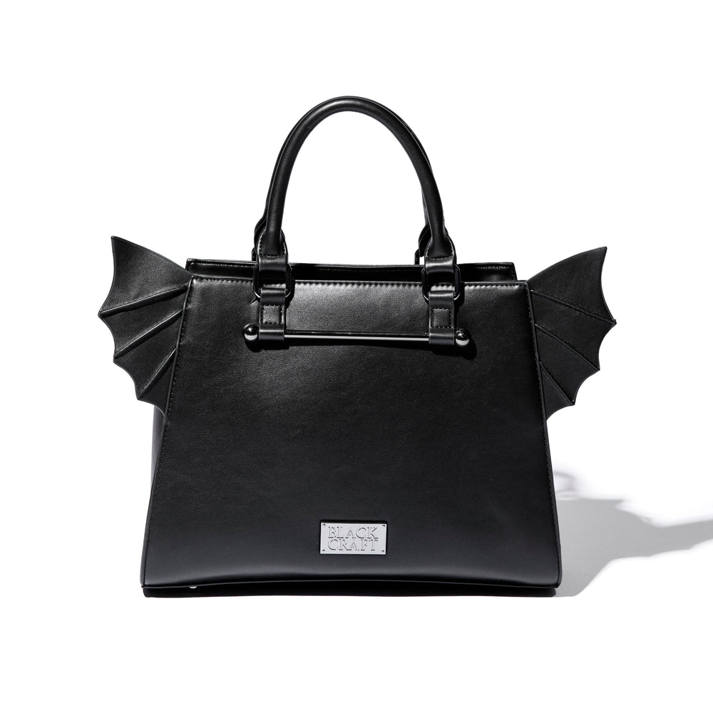 Black faux leather bat wing satchel. 