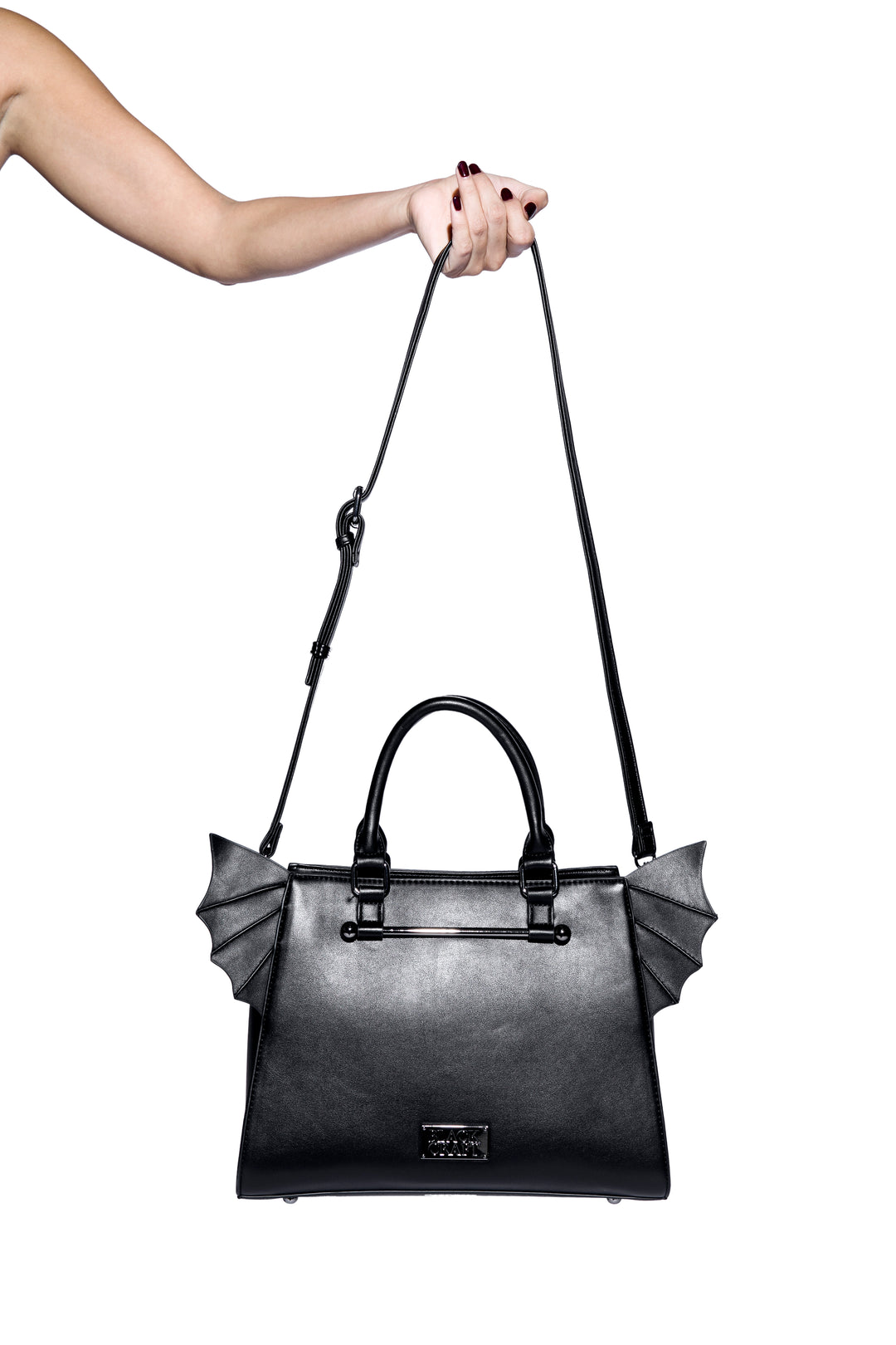 Black faux leather bat wing satchel. 