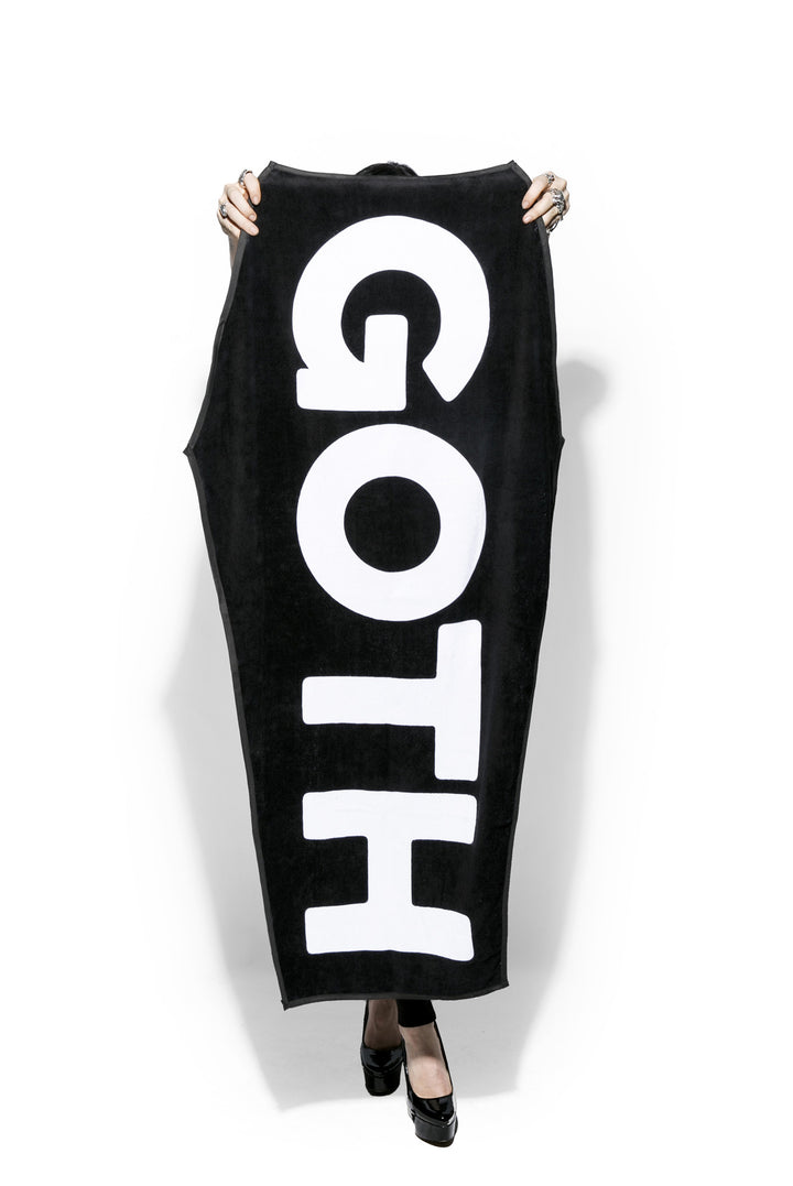 A black coffin shaped towel with Blackcraft artwork. Perfect for the beach or at home.