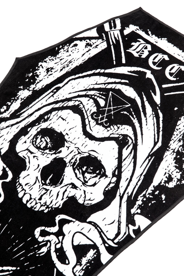 A black coffin shaped towel with Blackcraft artwork. Perfect for the beach or at home.