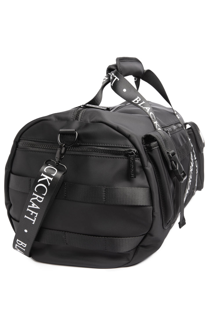 Black nylon duffel bag with Blackcraft rubber logo. 