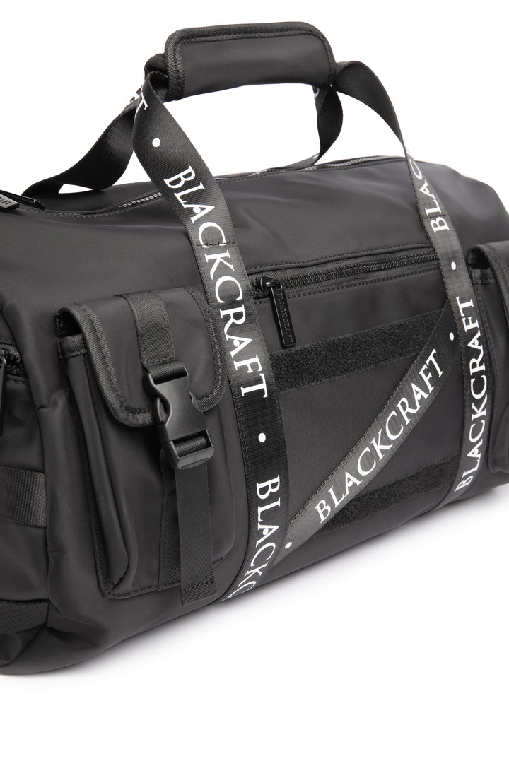 Black nylon duffel bag with Blackcraft rubber logo. 