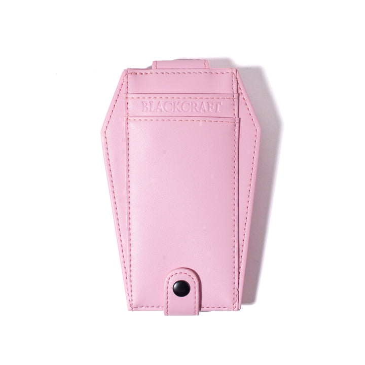 Pink faux leather cardholder in coffin shape.